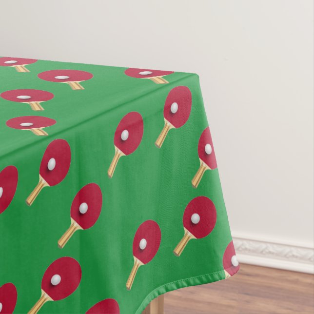 Table tennis racket and ball on green tablecloth (In Situ)