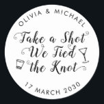 Take A Shot Tied the Knot Wedding Drink Favour Classic Round Sticker<br><div class="desc">A Classic Black Thank You Wedding Favour Label Sticker featuring "Take a Shot We Tied the Knot" in a rustic modern elegant font calligraphy. 
You can easily personalised it with your names and wedding date.</div>