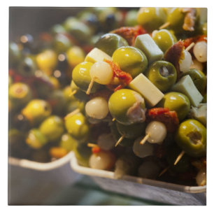 Tapas made with stuffed olives ceramic tile