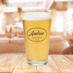 Taupe Stylised Wedding Best Man Name Glass<br><div class="desc">Beer glass for the wedding Best Man that features his name printed in a taupe colour, stylised script inside a taupe colour oval border along with wedding date. A great party supply idea for a bachelor party! Personalise your beer glass by editing and replacing name and date with your own....</div>