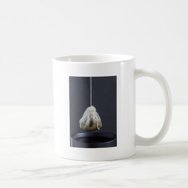 Tea bag is hung in a cup (Right)