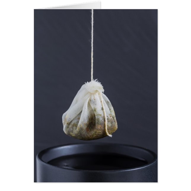 Tea bag is hung in a cup (Front)