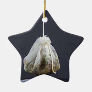 Tea bag is hung in a cup ceramic ornament