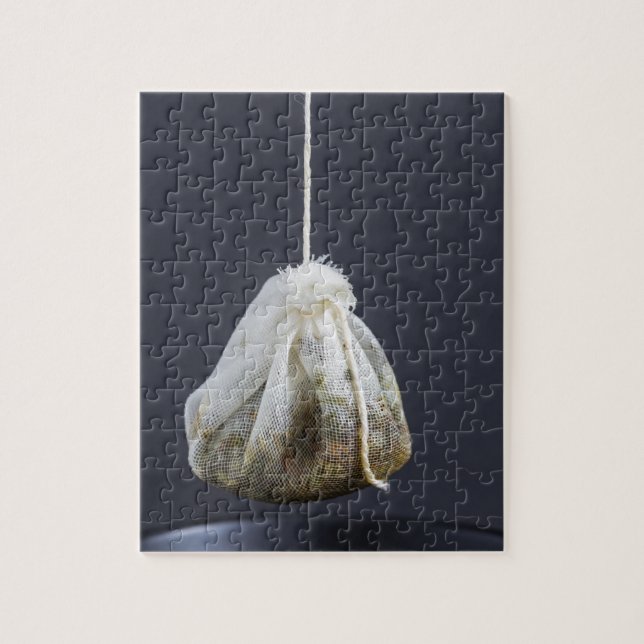 Tea bag is hung in a cup jigsaw puzzle (Vertical)