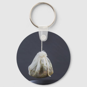 Tea bag is hung in a cup key ring
