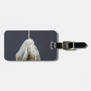 Tea bag is hung in a cup luggage tag