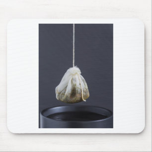 Tea bag is hung in a cup mouse pad
