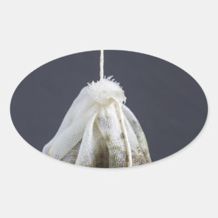 Tea bag is hung in a cup oval sticker