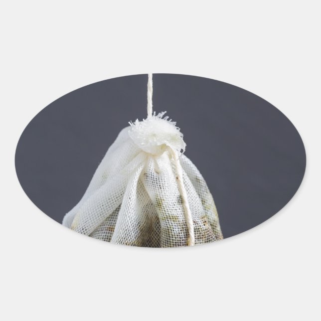 Tea bag is hung in a cup oval sticker (Front)