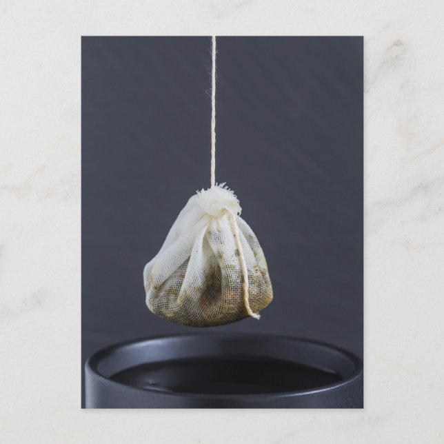 Tea bag is hung in a cup postcard (Front)