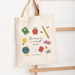 Teaching is a Work of Heart Tote Bag<br><div class="desc">Introducing our enchanting tote bag designed exclusively for teachers who inspire and nurture young minds. This tote bag combines practicality, personalisation, and a touch of whimsy, making it a perfect accessory for educators with a passion for teaching. The centerpiece of this tote bag design is a beautifully crafted quote, delicately...</div>