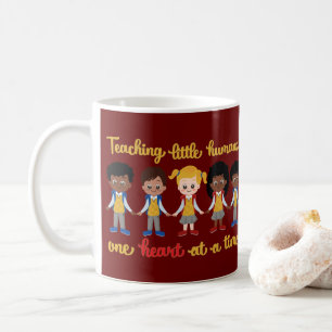 TEACHING LITTLE HUMANS ONE HEART AT A TIME COFFEE MUG