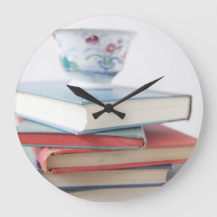 Teacup on book stack clock