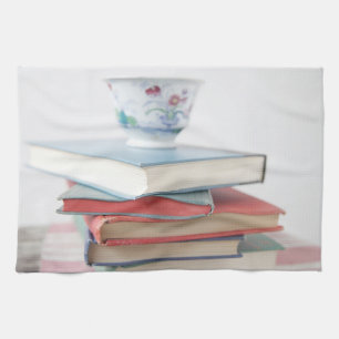 Teacup on book stack tea towel