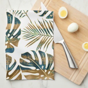 Teal and gold patterned tropical leaves tea towel