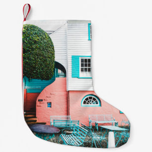 TEAL AND GRAY TABLE AND BENCH BESIDE WHITE AND ORA SMALL CHRISTMAS STOCKING