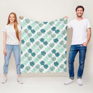Teal and grey monstera leaves patterned fleece blanket