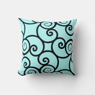 teal background and black abstract pattern pillow