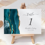 Teal Blue Gold Agate Wedding Table Number<br><div class="desc">The left-hand edge of this elegant modern wedding table number card features a teal blue watercolor agate border trimmed with faux gold glitter. The customisable text combines charcoal grey handwriting,  italic and copperplate fonts on a white background.</div>