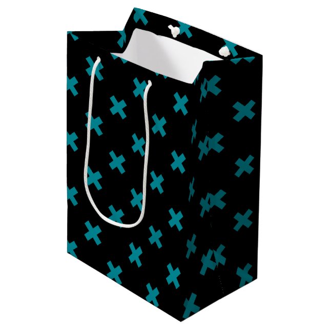 Teal cross stitches on black medium gift bag (Front Angled)