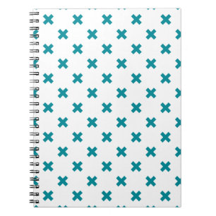 Teal cross stitches on white notebook