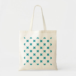 Teal cross stitches on white tote bag