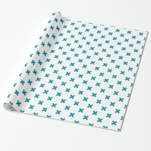 Teal cross stitches on white wrapping paper