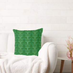 Teal hearts on green cushion