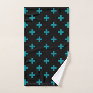 Teal polka crosses on black hand towel