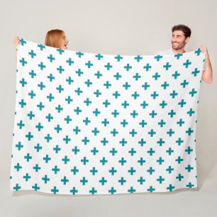 Teal polka crosses on white fleece blanket