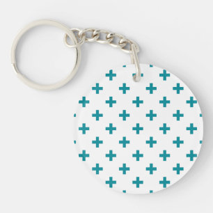 Teal polka crosses on white key ring
