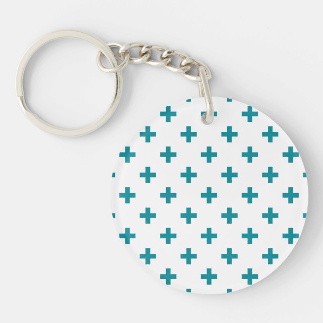 Teal polka crosses on white key ring (Front)