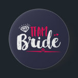 Team Bride Bachelorette Party Wedding Button<br><div class="desc">Team bride button. Perfect for bridal shower and bachelorette party accessories before the wedding. Navy blue,  white and pink with diamond and small hearts. Background colour can be customised to your desired colour theme. This pin is for the bridesmaid,  maid of honour,  bride's families and friends.</div>