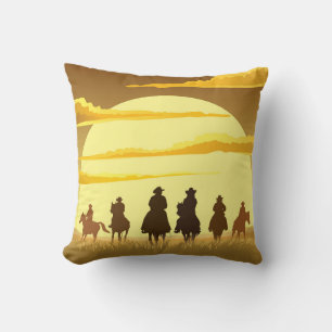 Team of cowboys silhouette galloping against a sun cushion