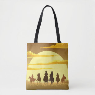 Team of cowboys silhouette galloping against a sun tote bag