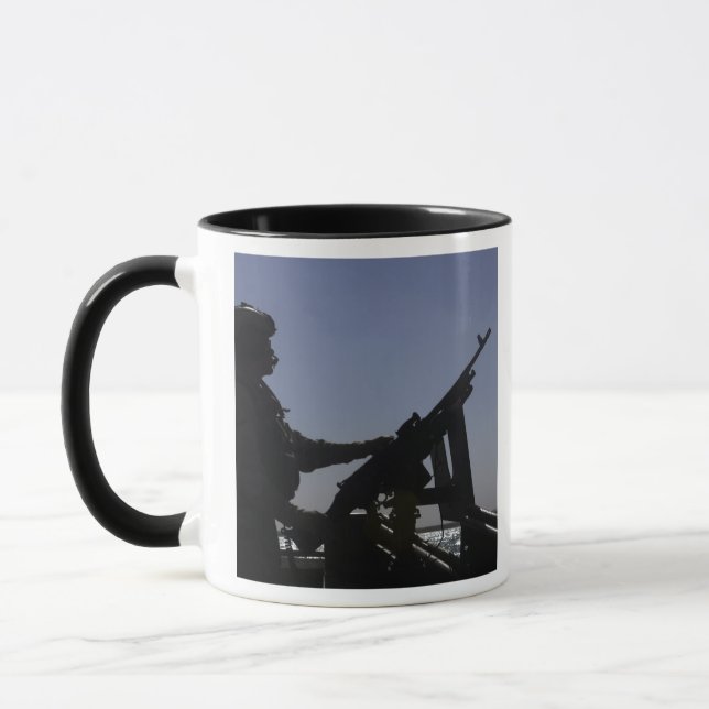 Technician manning an M240 machine gun in Iraq Mug (Left)