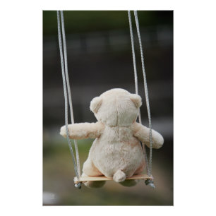 Teddy bear on a swing in motion. poster