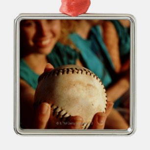 Teenage girls' softball team sitting in dugout metal ornament