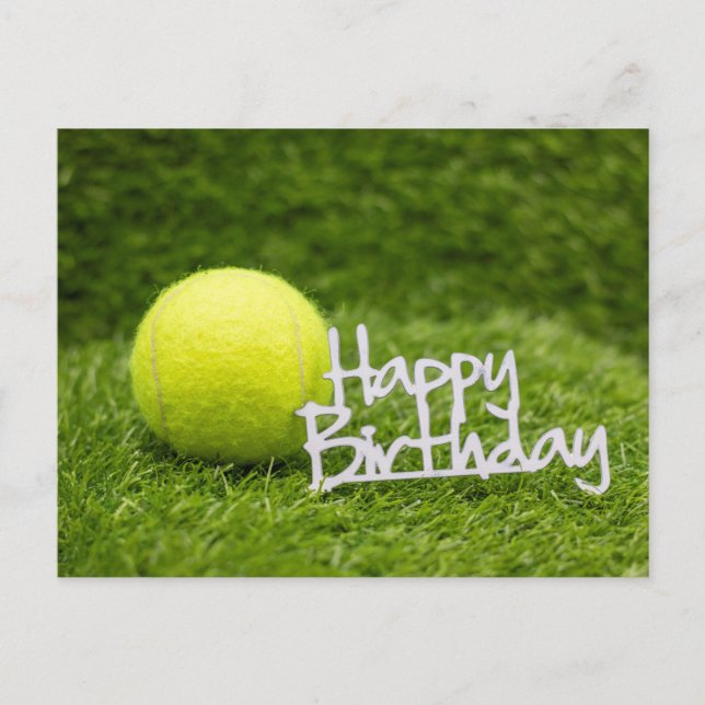 Tennis ball and happy birthday word on green grass postcard (Front)