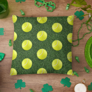 Tennis ball on green grass cushion