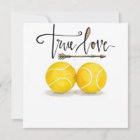 Tennis ball with LOVE on blue court