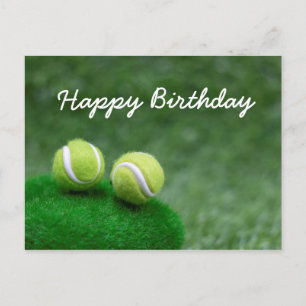 Tennis balls are on green grass birthday card