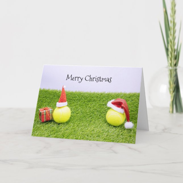 Tennis Christmas with tennis ball and Santa hat Holiday Card (Front)