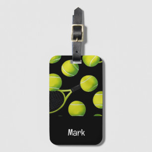 Tennis racket and ball on green grass luggage tag