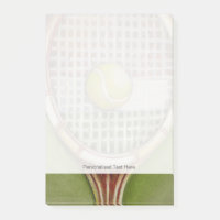 Tennis Racket with Ball Laying on Court