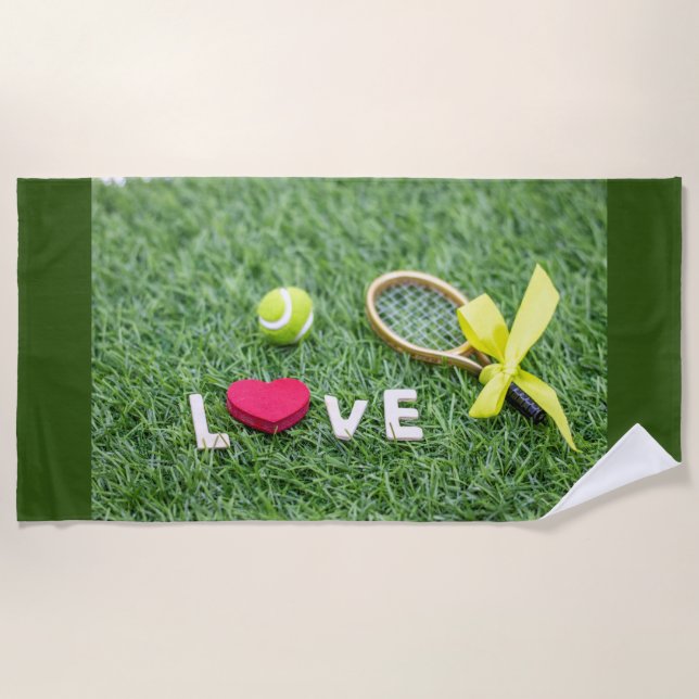 Tennis with love tennis ball and racket on green beach towel (Front)