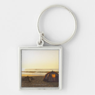 Tent and Burned out Campfire on the Beach. Key Ring