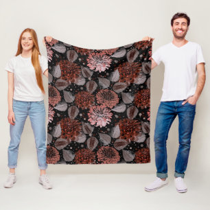 Terracotta flowers with grey leaves on a black  fleece blanket