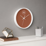Terracotta Minimalist White Monogram Clock<br><div class="desc">Minimalist White Monogram Emblem Terracotta Background Home Office Kitchen Living Room Bathroom Clock</div>