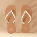 Terracotta Modern Elegant Minimal Simple Monogram Thongs<br><div class="desc">These trendy and stylish Terracotta Modern Elegant Minimal Simple Monogram Flip Flops offer a minimalistic design that blends seamlessly with the contemporary aesthetic. The terracotta colour palette adds an elegant touch to your footwear, while the personalised monogram brings a unique and personal aspect to your look. These flip flops make...</div>